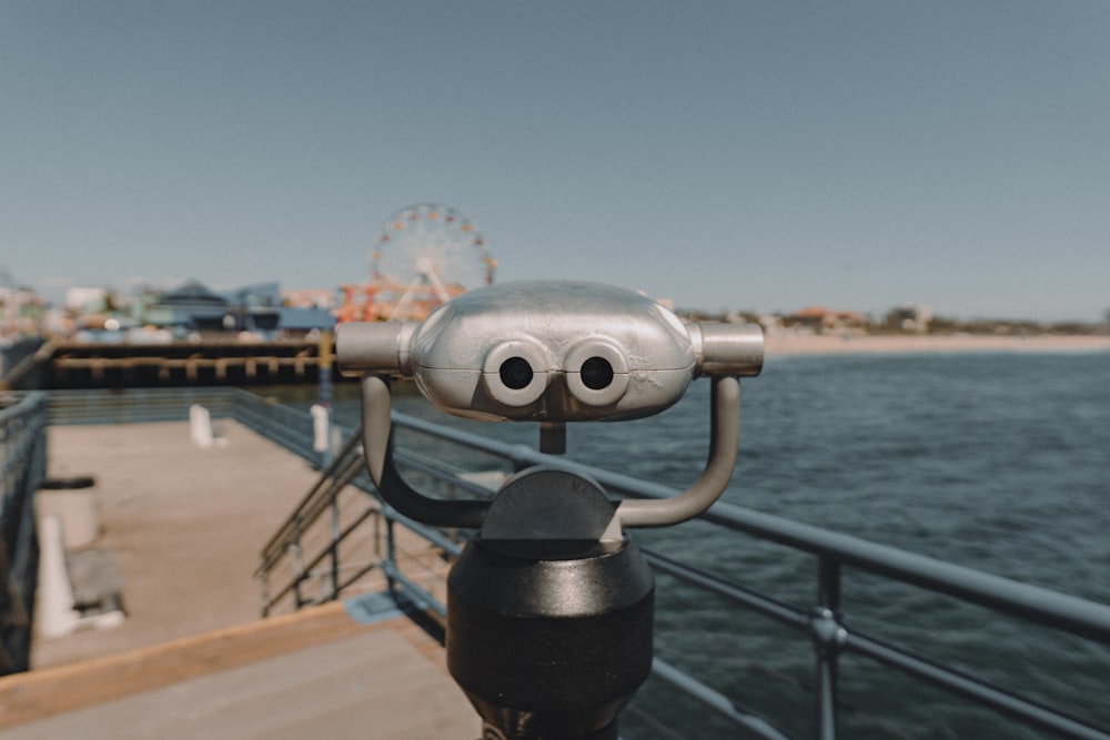 black and silver coin operated binoculars