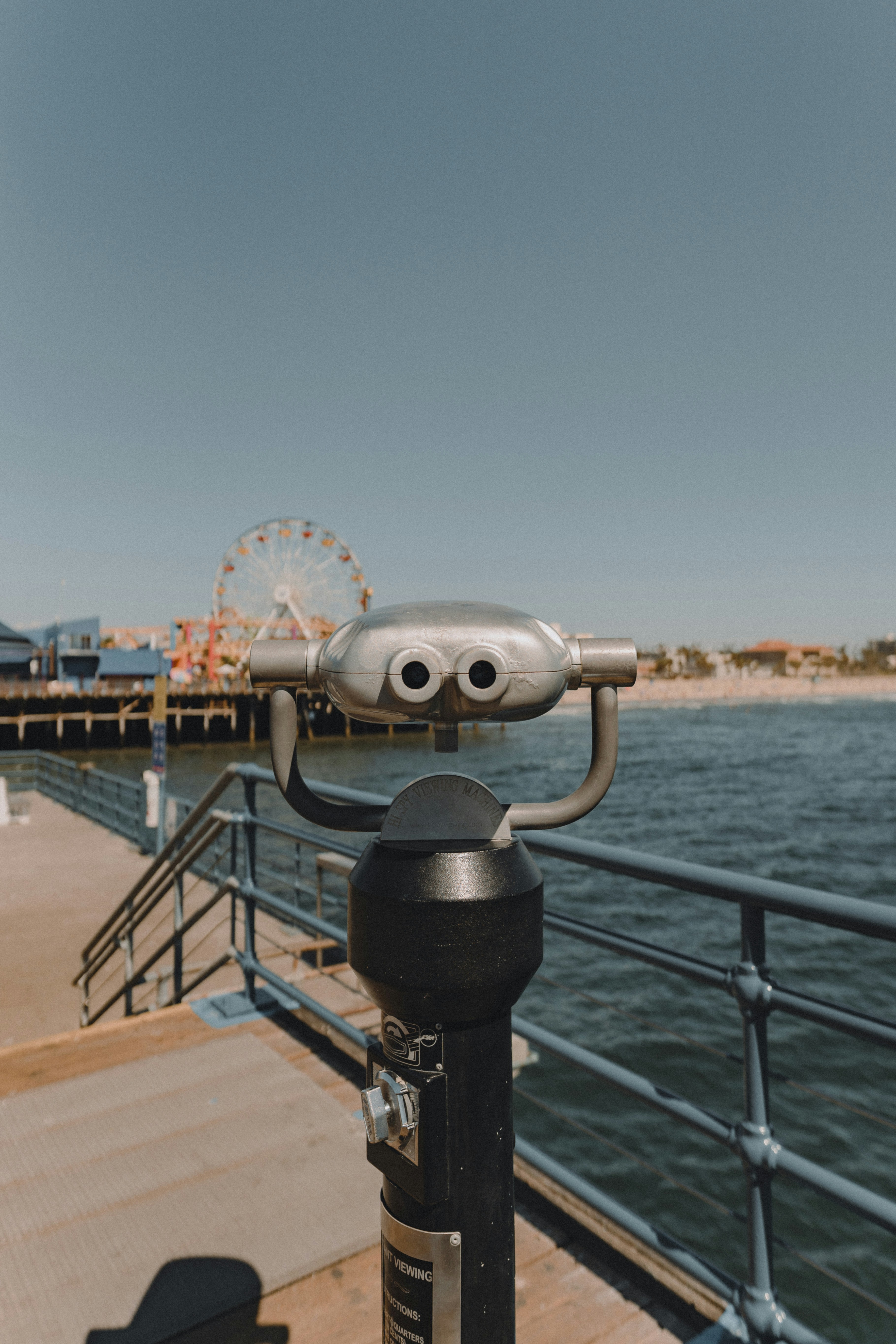 Gray and black coin operated telescope on dock during daytime photo – Free  Beach Image on Unsplash