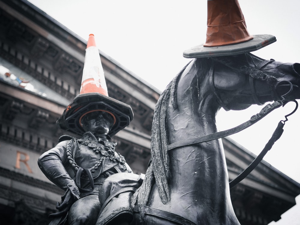 man riding horse statue during daytime