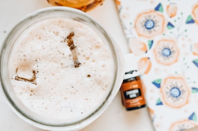 Close-up of artisanal accessories displayed alongside a refreshing beverage glass.