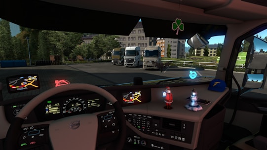 A close-up of a truck driver reviewing a route map inside a cab.