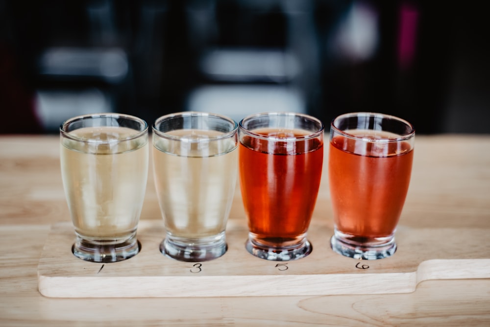 3 clear drinking glasses on white table