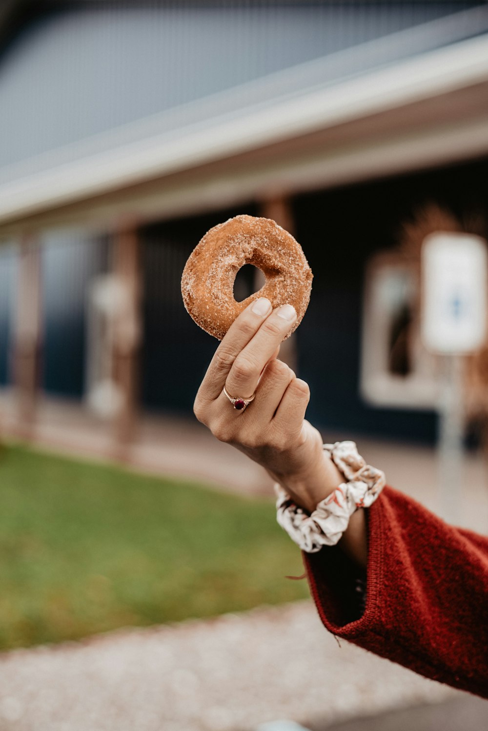person holding doughnut during daytime