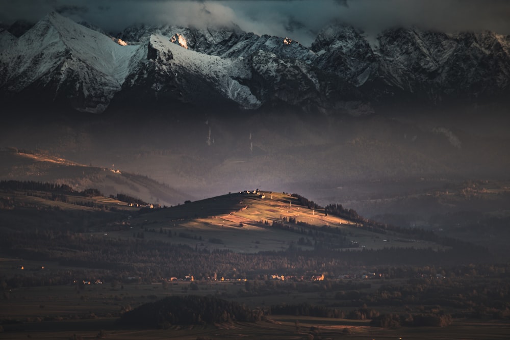 snow covered mountain during night time