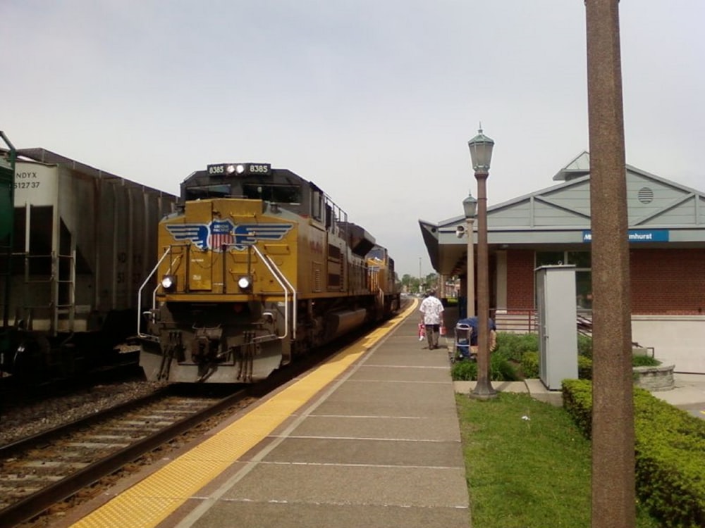 yellow train on rail road