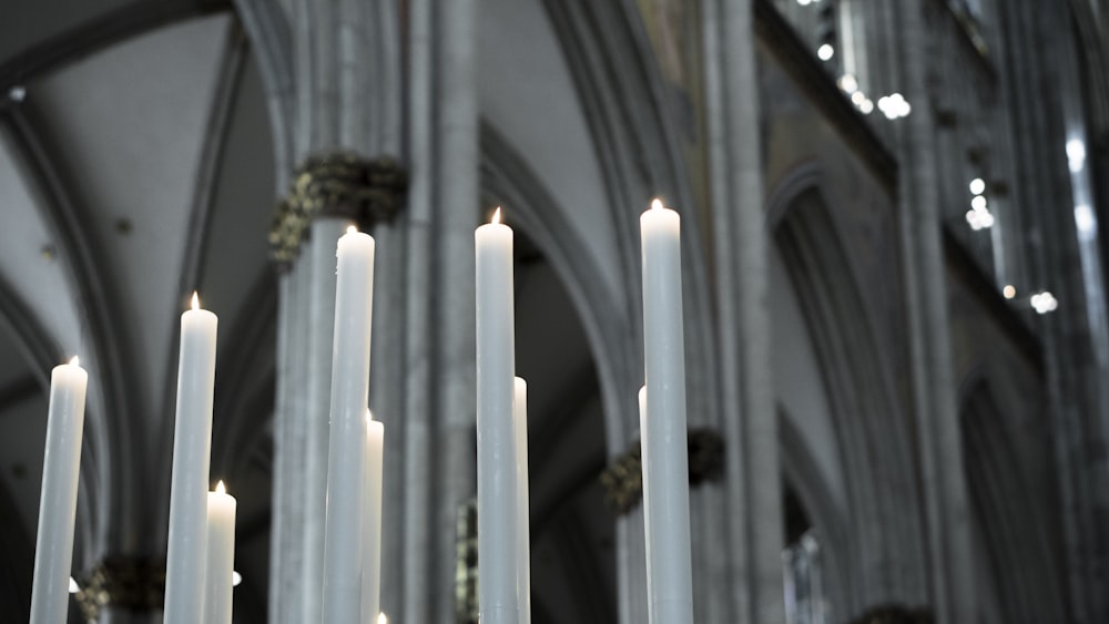 white candles on white candle holder