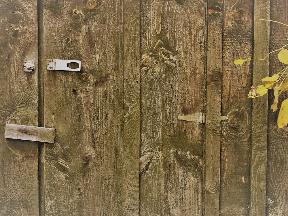 brown wooden door with white and black rectangular device