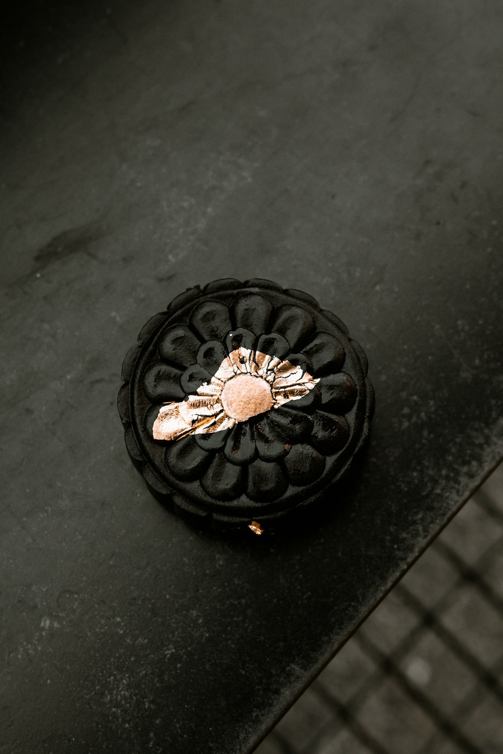 black and gold round ornament