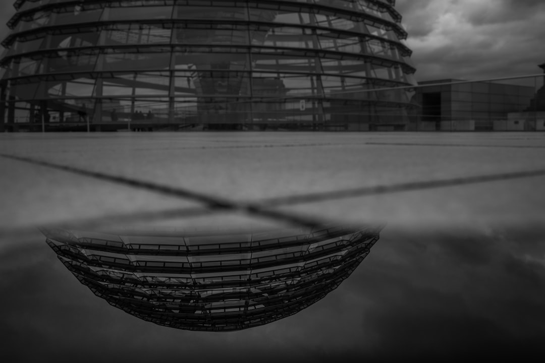 grayscale photo of glass building