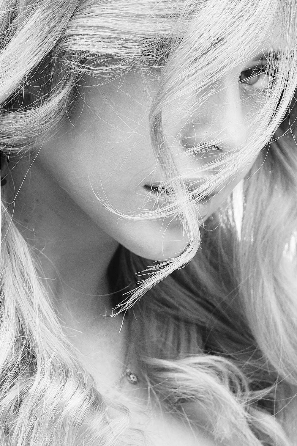 grayscale photo of woman with blonde hair