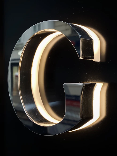 A sleek modern graphic of an upward arrow integrated with the letter 'g', symbolizing digital growth and opportunity.