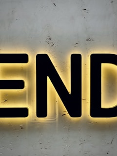 yellow and black m letter