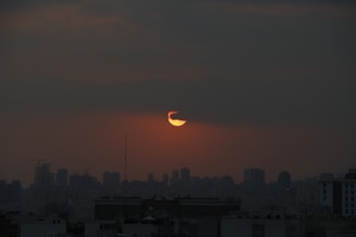 silhouette of city buildings during sunset