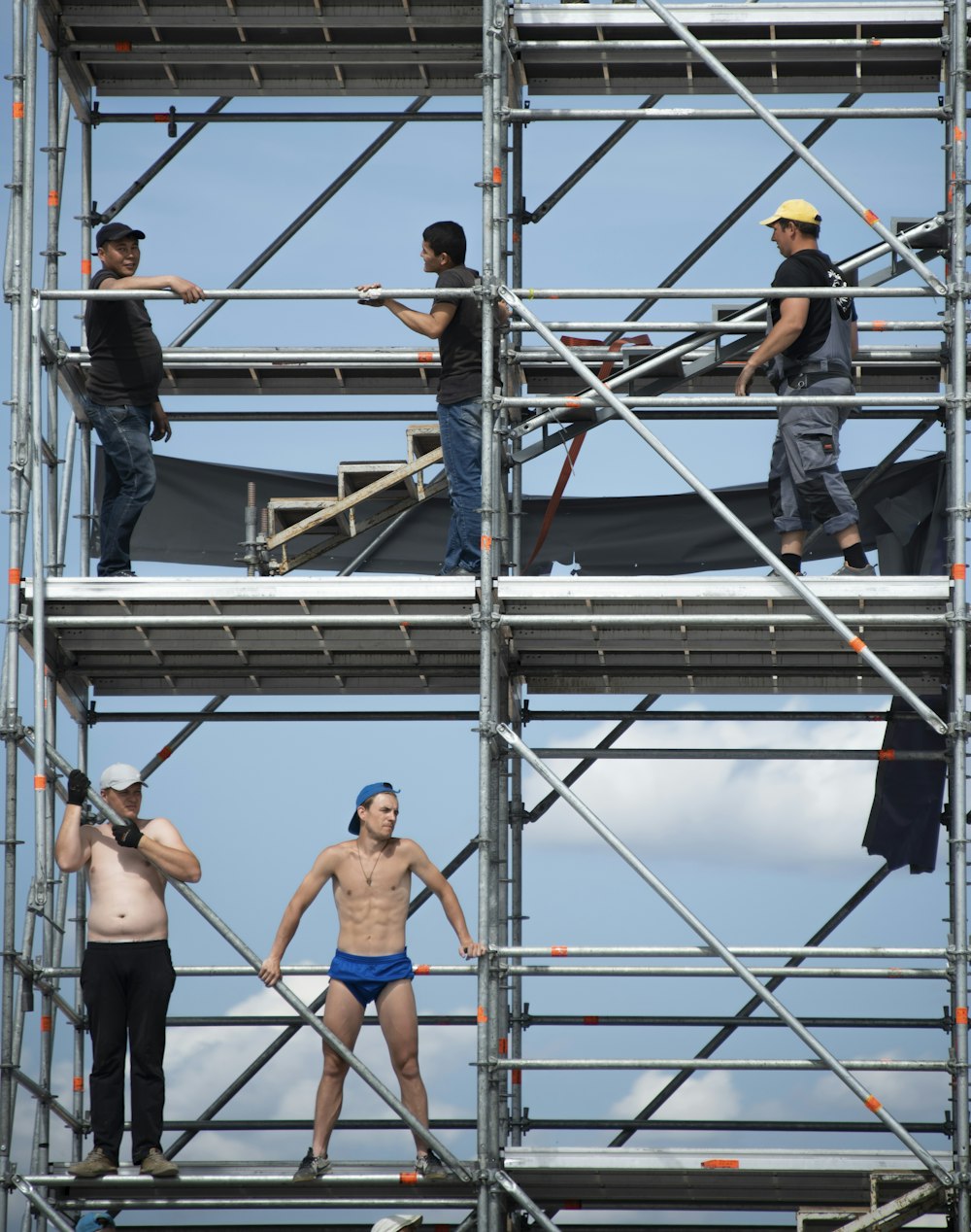 3 women climbing on ladder