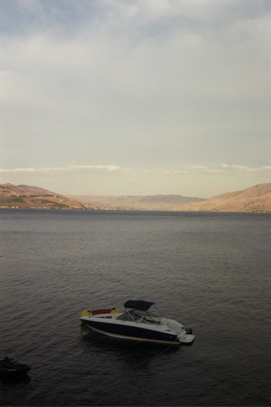 white and black motor boat on sea during daytime