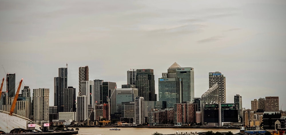 a large body of water with a city in the background