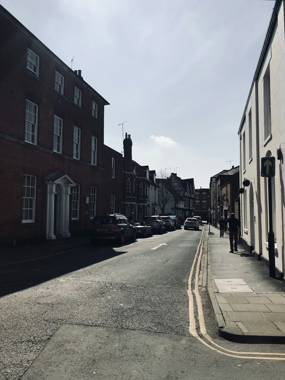 cars parked beside the road during daytime