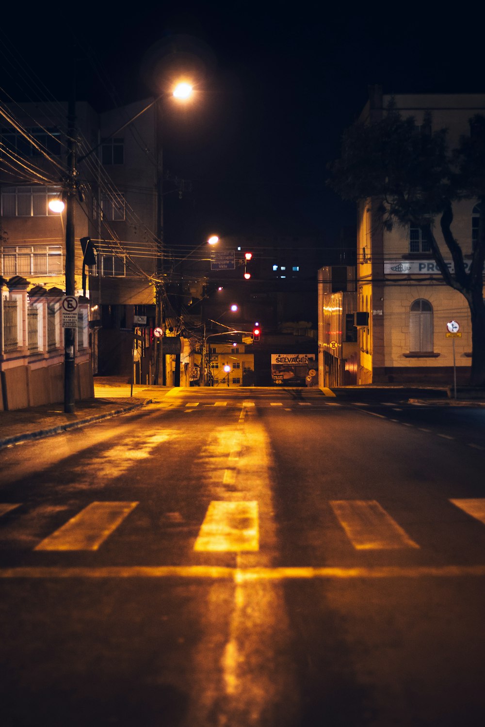 an empty street at night with no traffic