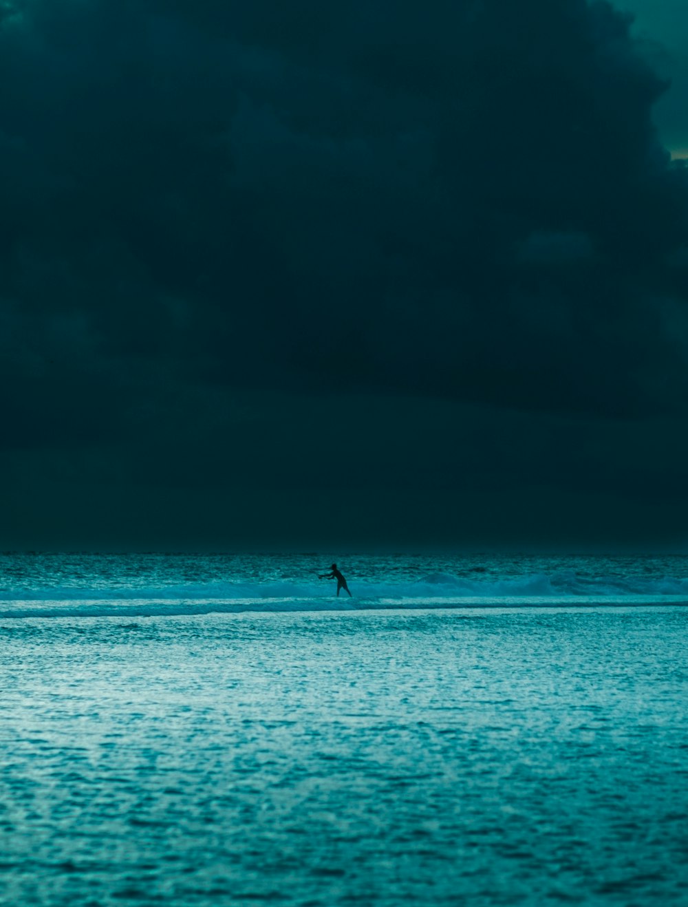 person in body of water during daytime