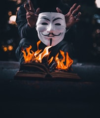 white and black mask with fire