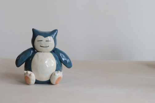 white and blue cat figurine