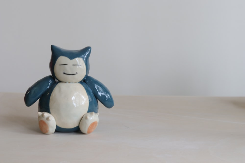 white and blue cat figurine