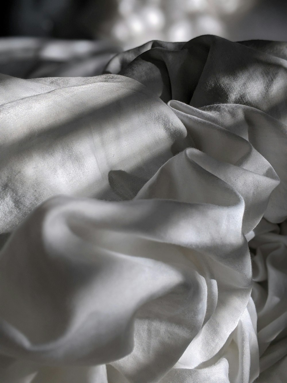 white textile on black textile