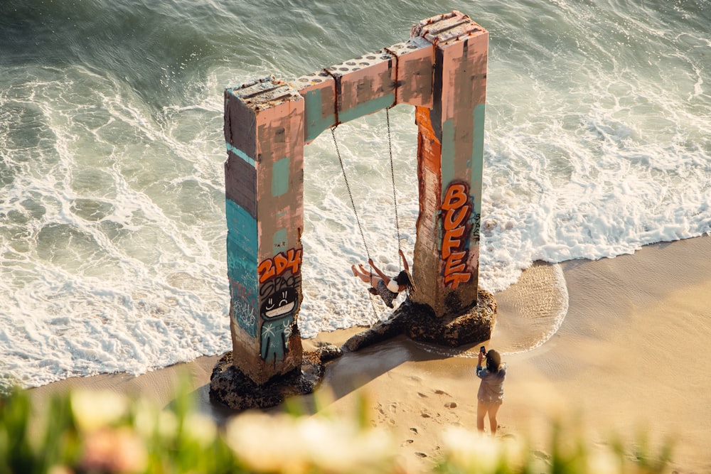 brown wooden ladder on seashore during daytime