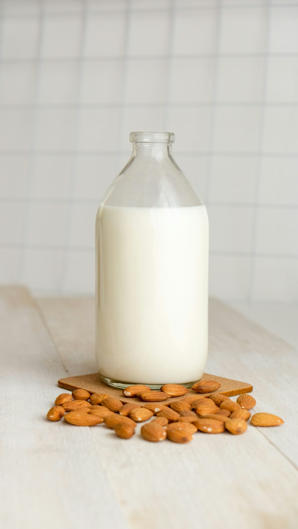 white milk in clear glass bottle