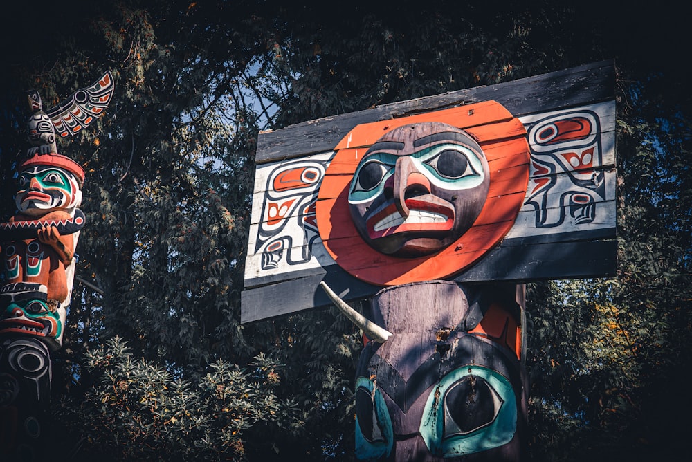 red black and white wooden human face wall art