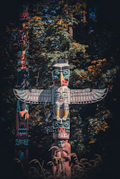 brown and blue wooden statue