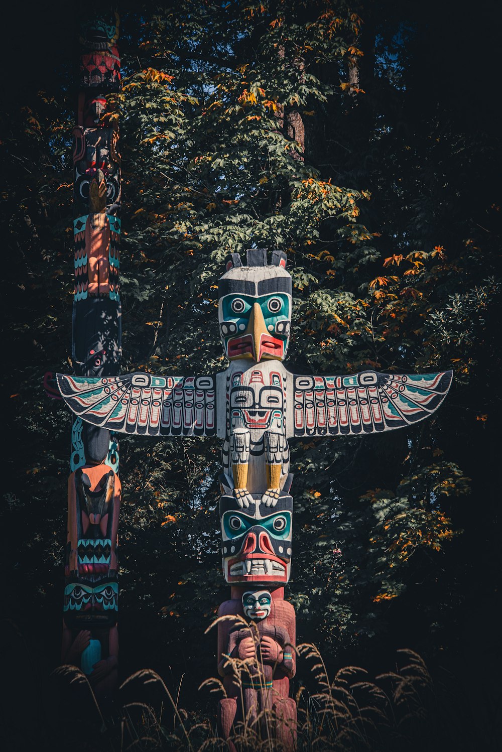 brown and blue wooden statue