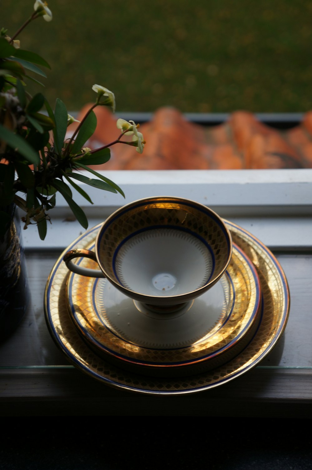 white and brown ceramic cup on saucer