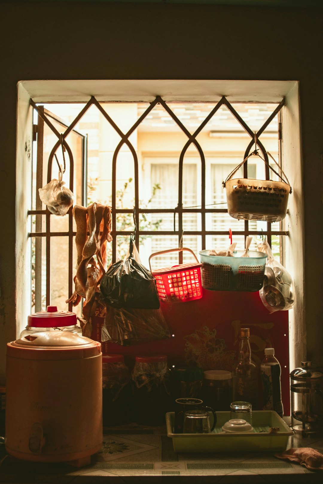 red plastic basket on white metal frame