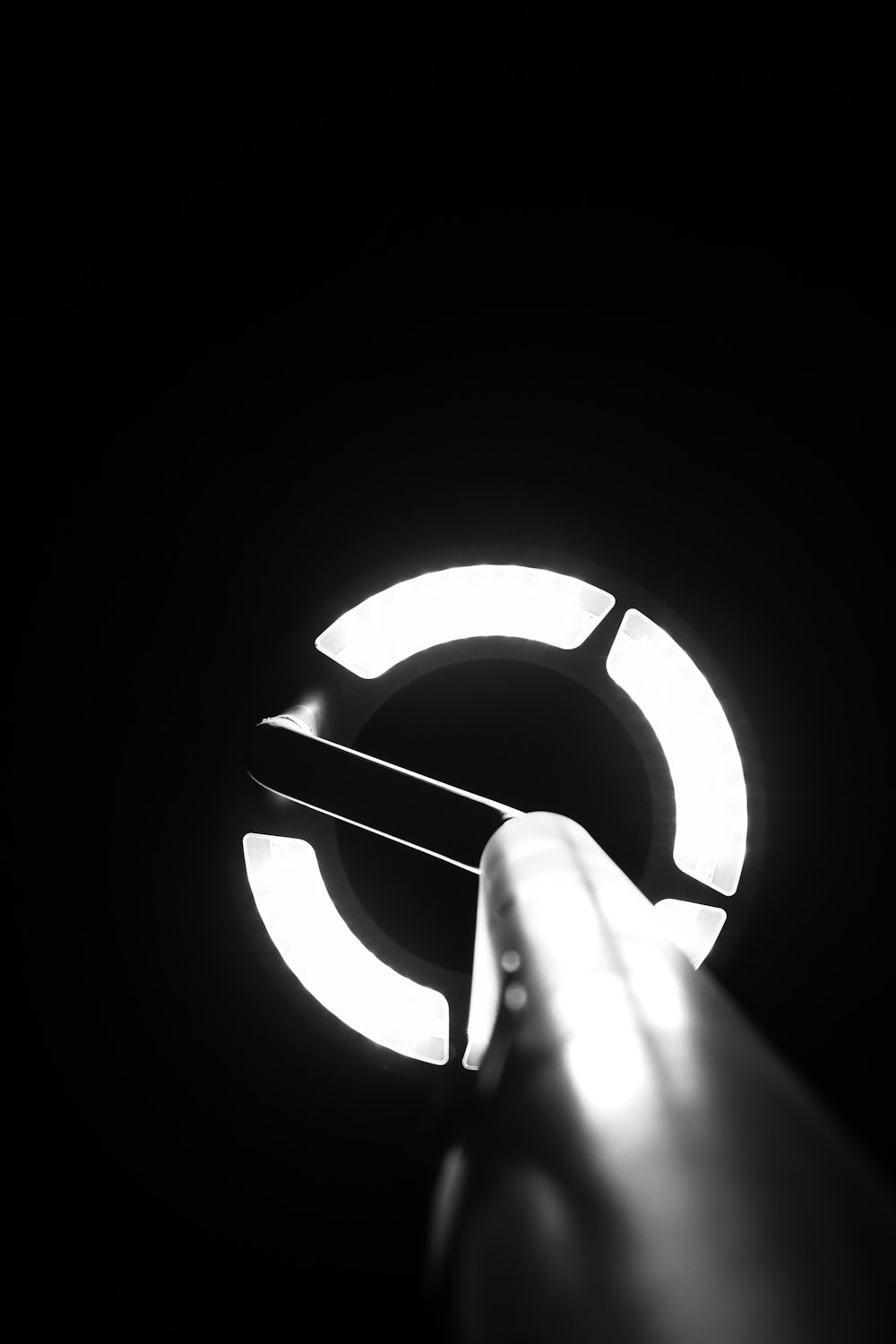 person holding lighted round light