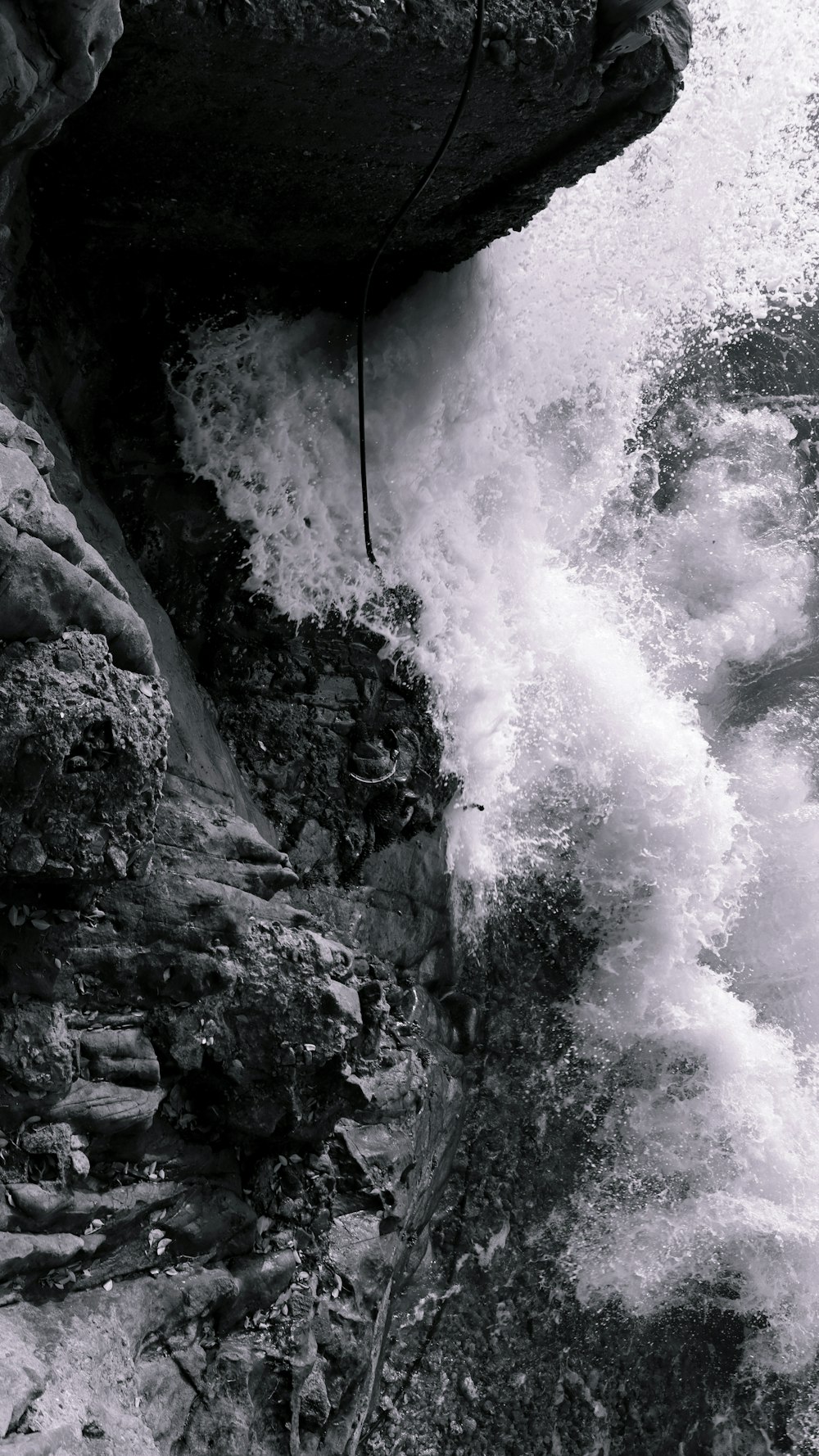 gray scale photo of water falls