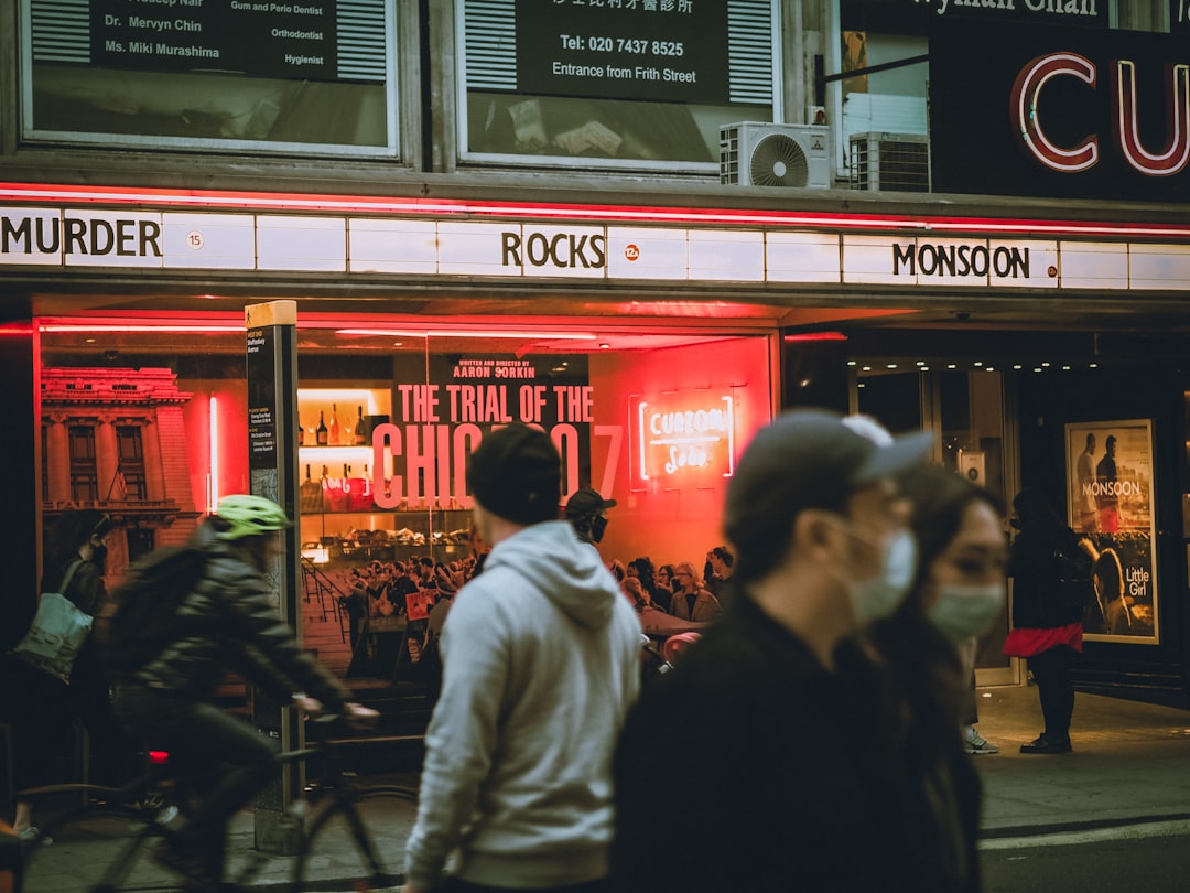 people in front of red and white store during nighttime