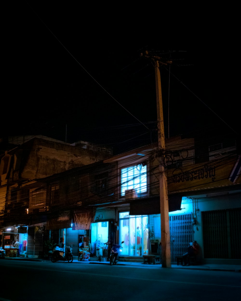 people walking on street during night time