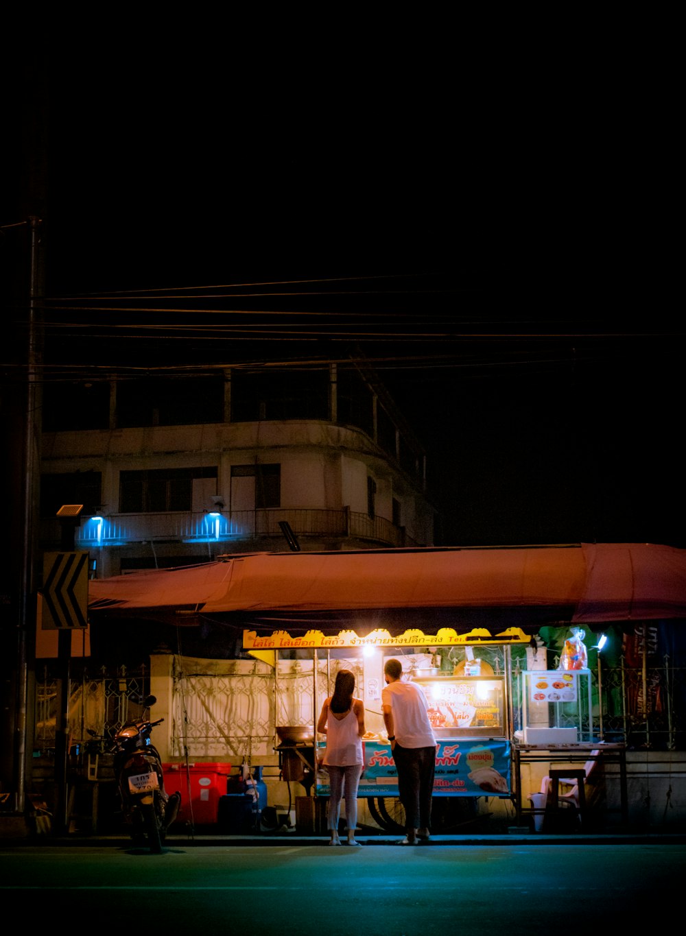 people walking on street during nighttime