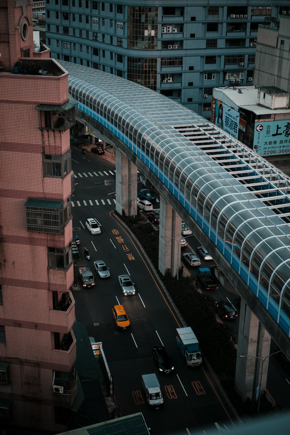 cars on road near building during daytime