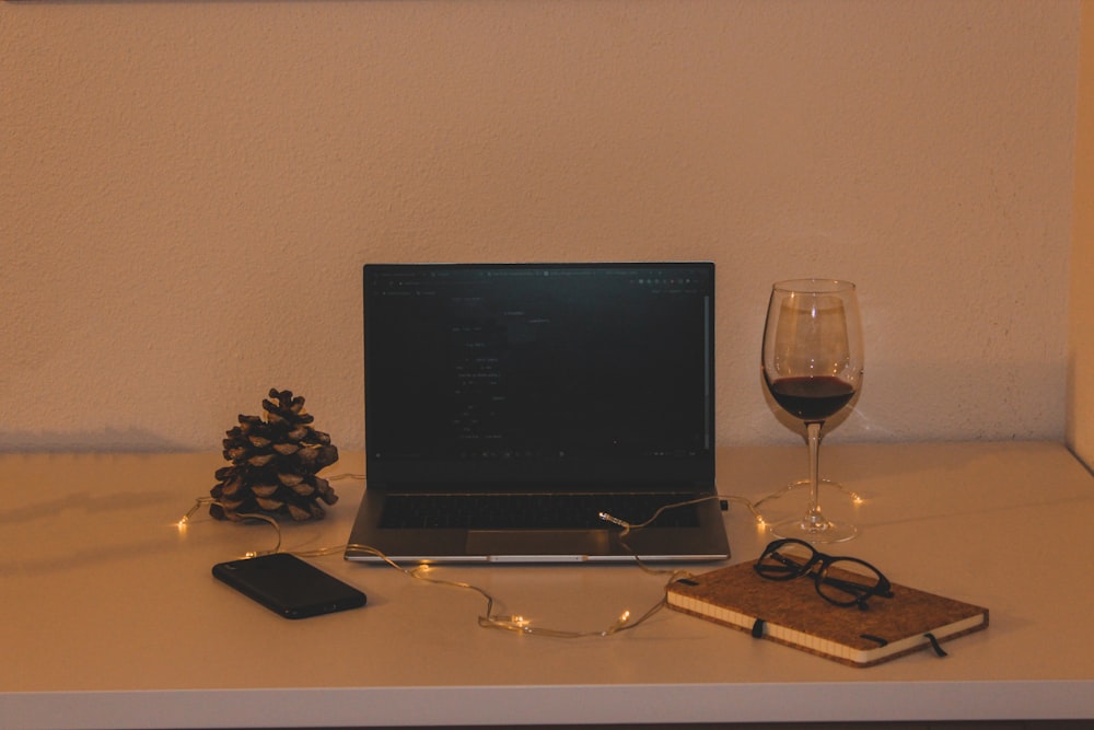 black flat screen computer monitor beside black laptop computer