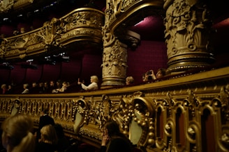 people sitting on gold chair