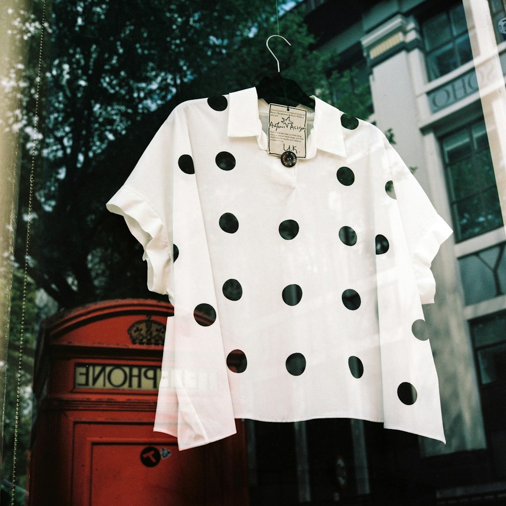 white and black polka dot shirt