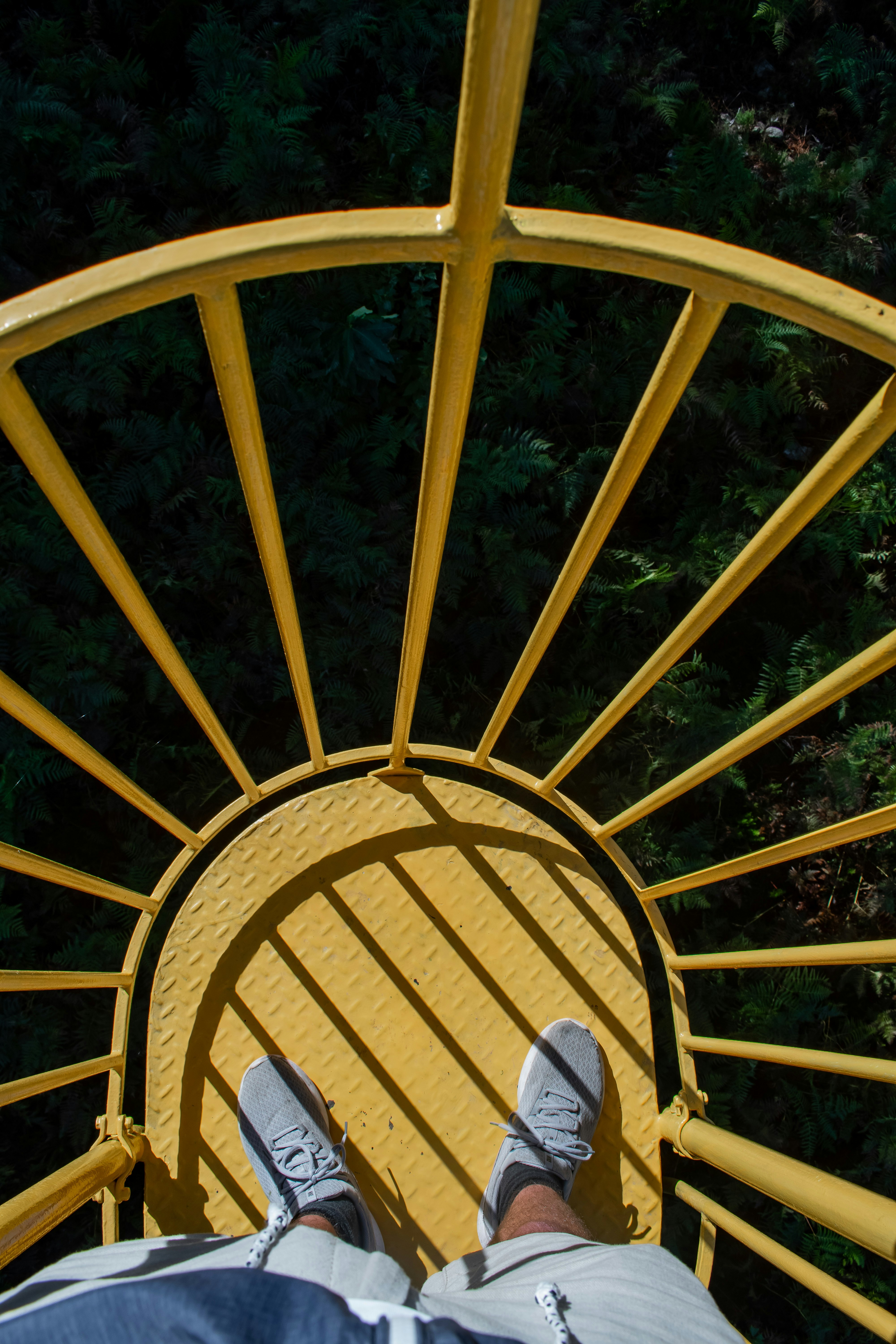 yellow metal round frame on brown wooden table