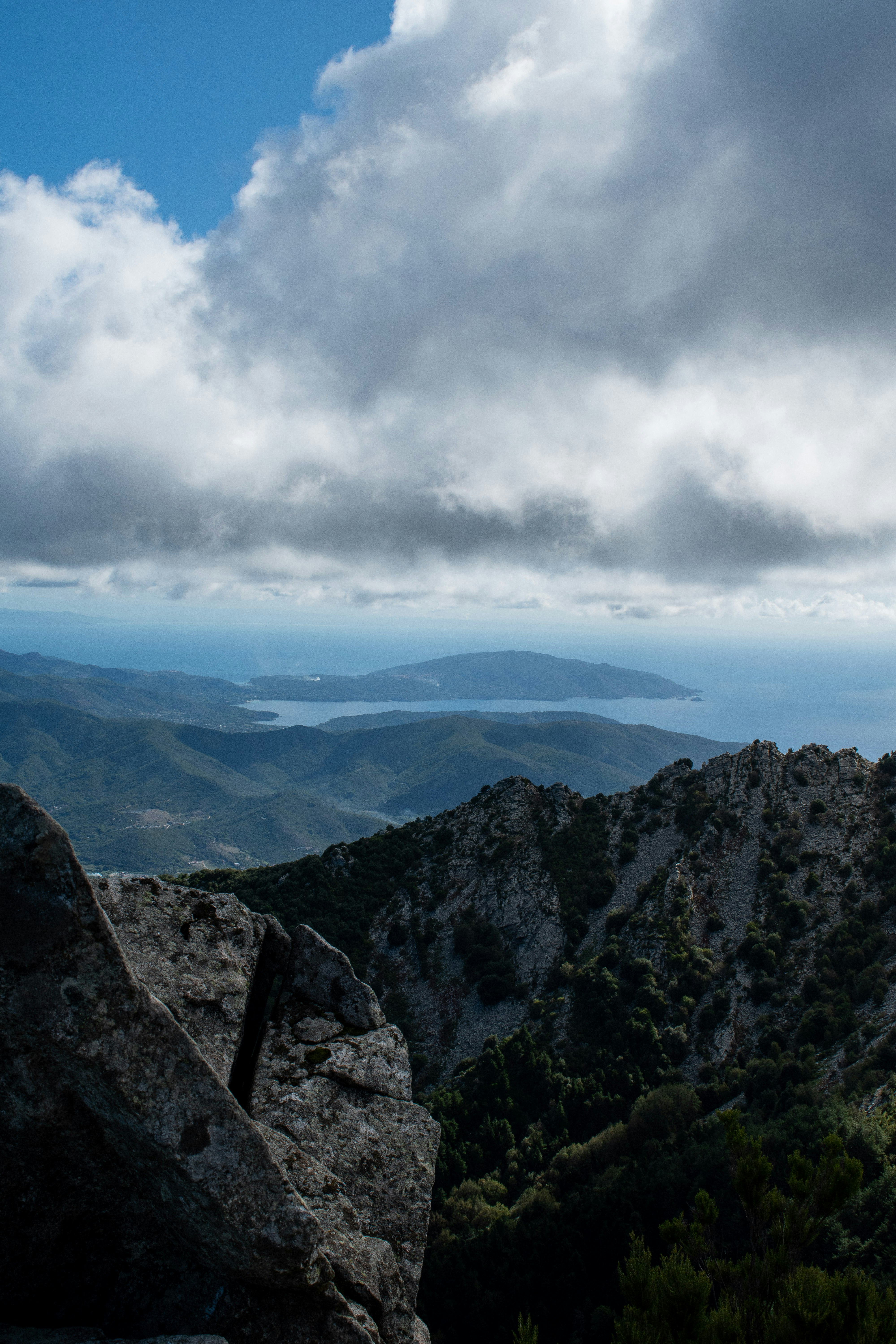 green and brown mountains under white clouds during daytime