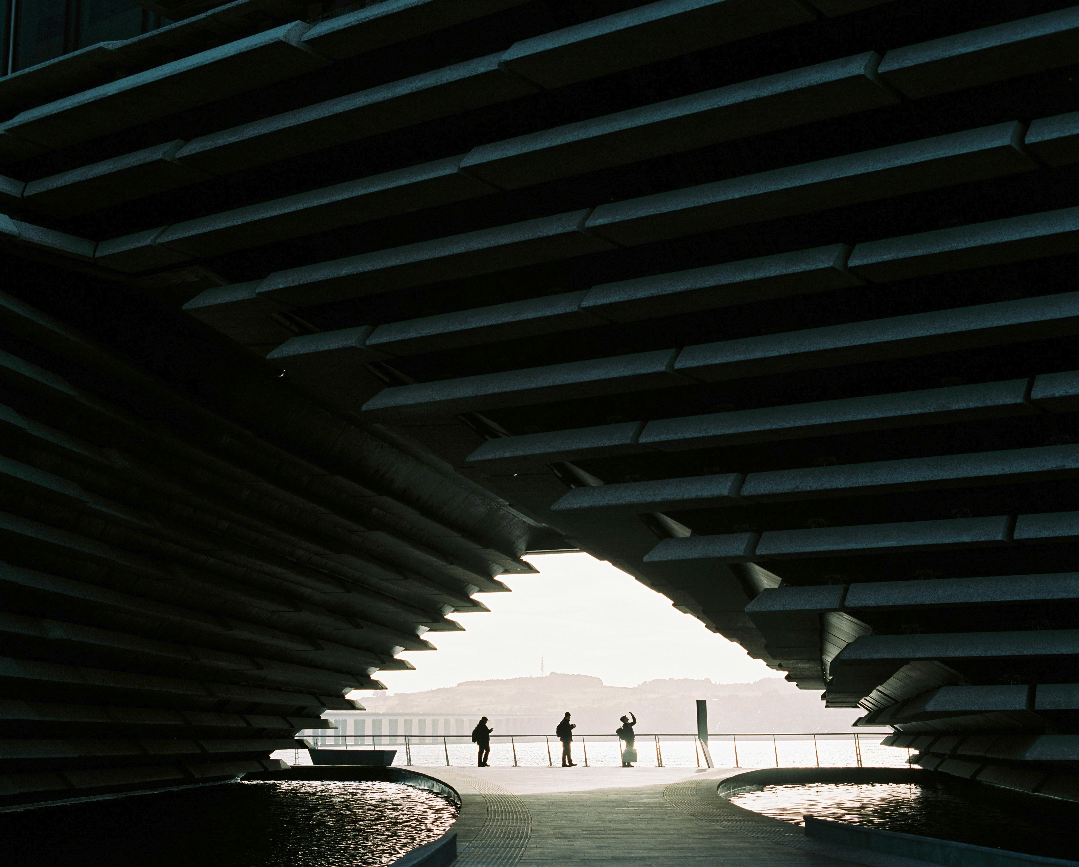 21 Places of The Future. people walking on beach during daytime