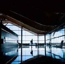 Business travelers confidently walking through a modern airport terminal