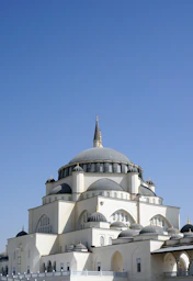white and brown concrete building under blue sky during daytime
