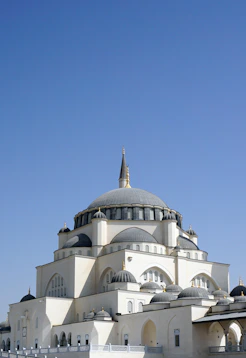 white and brown concrete building under blue sky during daytime