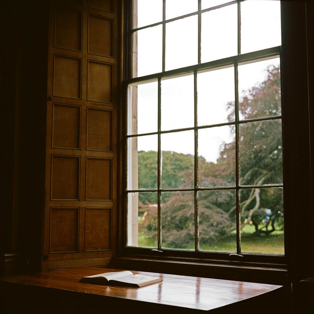 brown wooden framed glass window